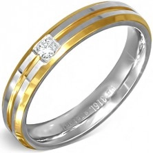 Srebrno-zlat prstan iz jekla z majhnim prozornim cirkonom