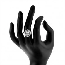 Srebrn prstan 925, širša kontura s simboli neskončnosti, ovalen prozoren cirkon
