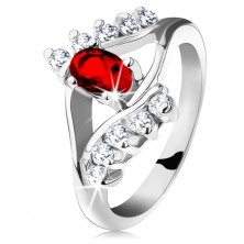 Bleščeč prstan srebrne barve, rdeč brušen oval, prozorni cirkoni