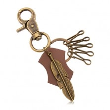 Obesek za ključe v medeninasti barvi - pas iz umetnega  usnja, veliko pero z izrezom