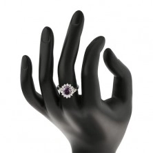 Lesketav prstan srebrne barve, velik ovalen cvet iz cirkonov