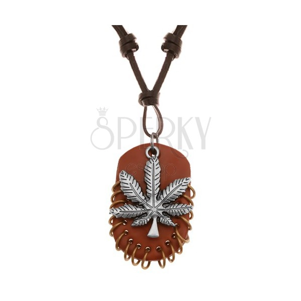 Ogrlica iz sintetičnega usnja, obeska - konopljin list in rjav oval z obročki, različne barve