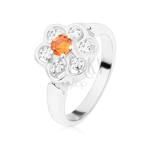 Prstan srebrne barve, sijoča prozorna cvetlica z oranžno sredino