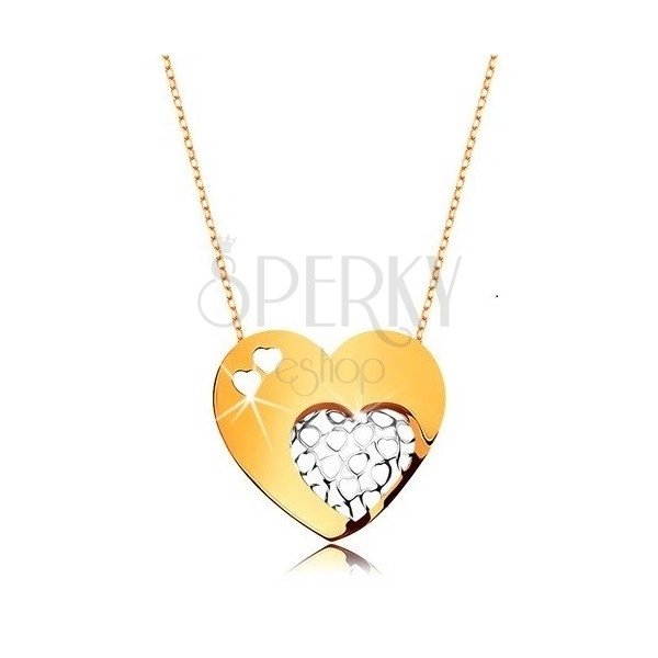 Ogrlica iz 9-k zlata – tanka verižica, veliko srce, okrašeno z izrezi srčka